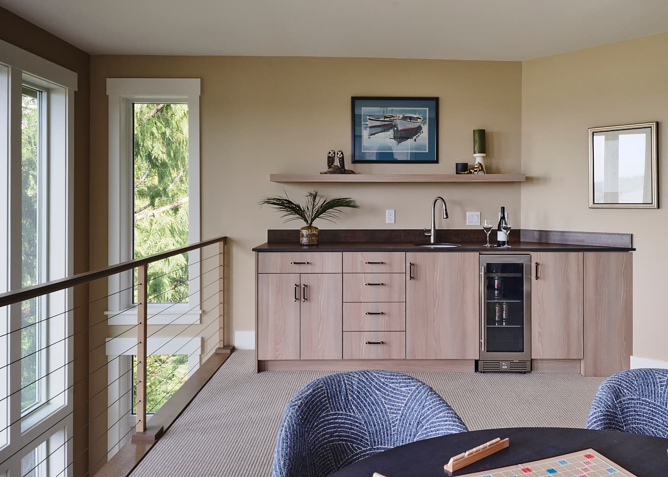 a wet bar with a sink and cabinets